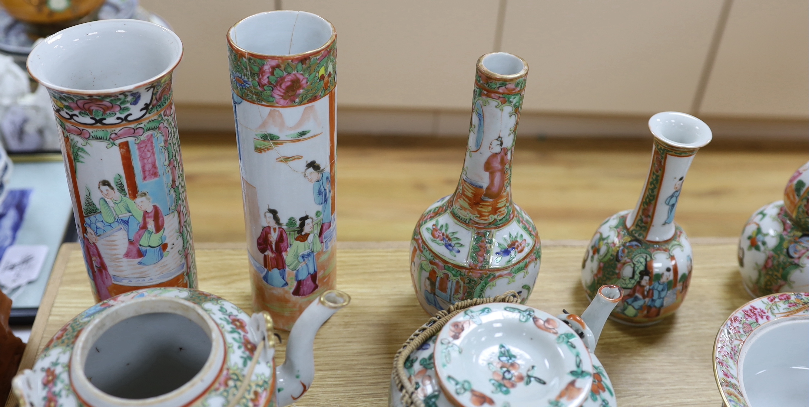 A quantity of 19th century Chinese famille rose dishes, plates, teapots and vases, tallest 21.5cm